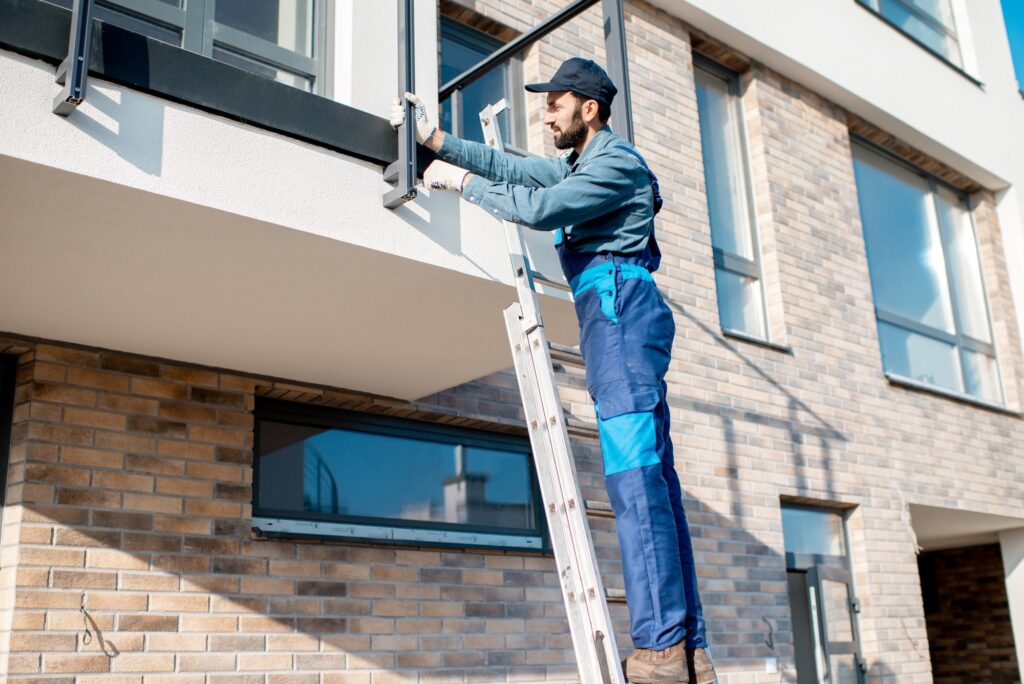 Builder mounting balcony fence